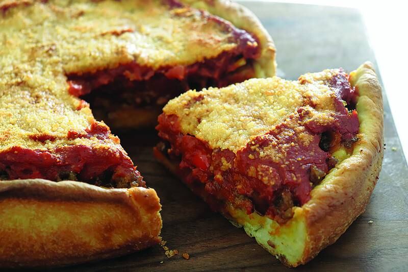 A classic Chicago-style deep dish pizza is characterized by a buttery crust, tons of cheese and a super flavorful sauce.