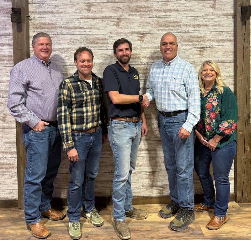 Kurt Aumann (from left), Tyson Reed and Alex Fuselier of Aumann Auctions and Cory and Julie Craig of Cory Craig Auctioneer announce a merger of the two Midwest auction companies.