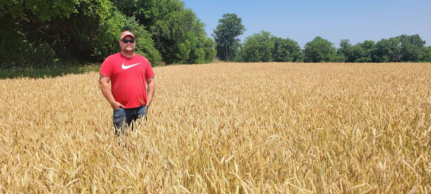 “Wheat” — Nancy Baird: “Our son, Byron, standing in our field of wheat.”