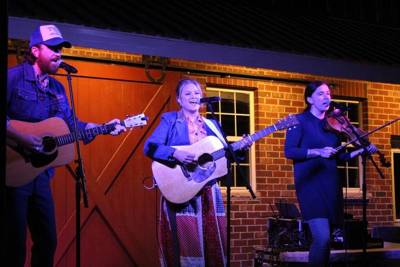 Hailey Whitters (center) and her band perform during a private, on-farm concert at Spirit Farms for members of the Yorkville Christian FFA Chapter. The chapter won the 2024 Rock the Crop contest, provided by Firestone Ag to celebrate the company’s 80-year support of the National FFA Organization.
