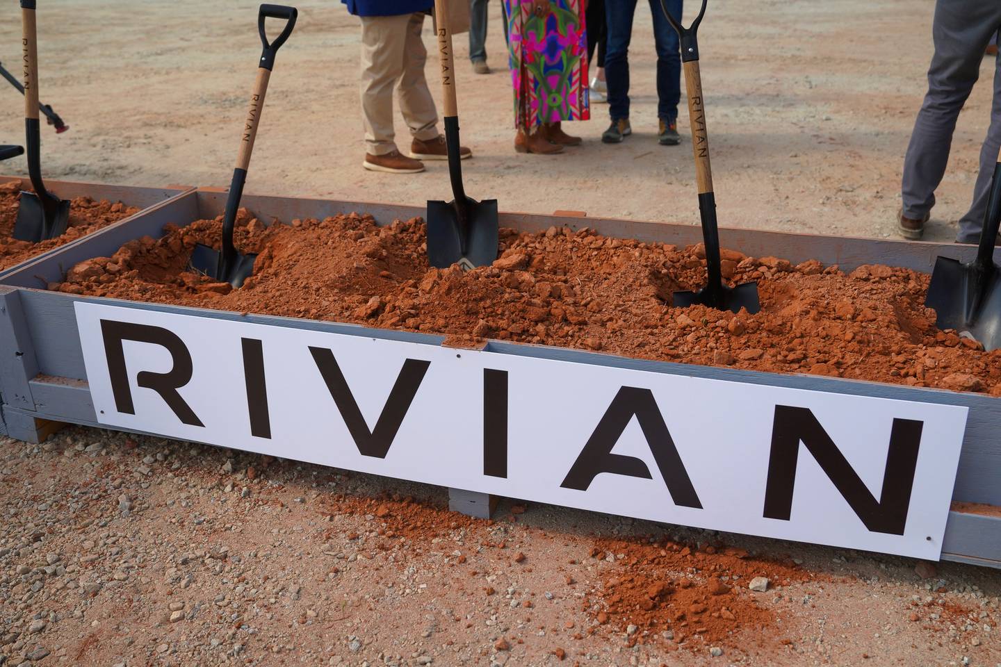 Shovels stick out of a box of dirt after a groundbreaking ceremony for Rivian’s future plant outside of Social Circle, Georgia.