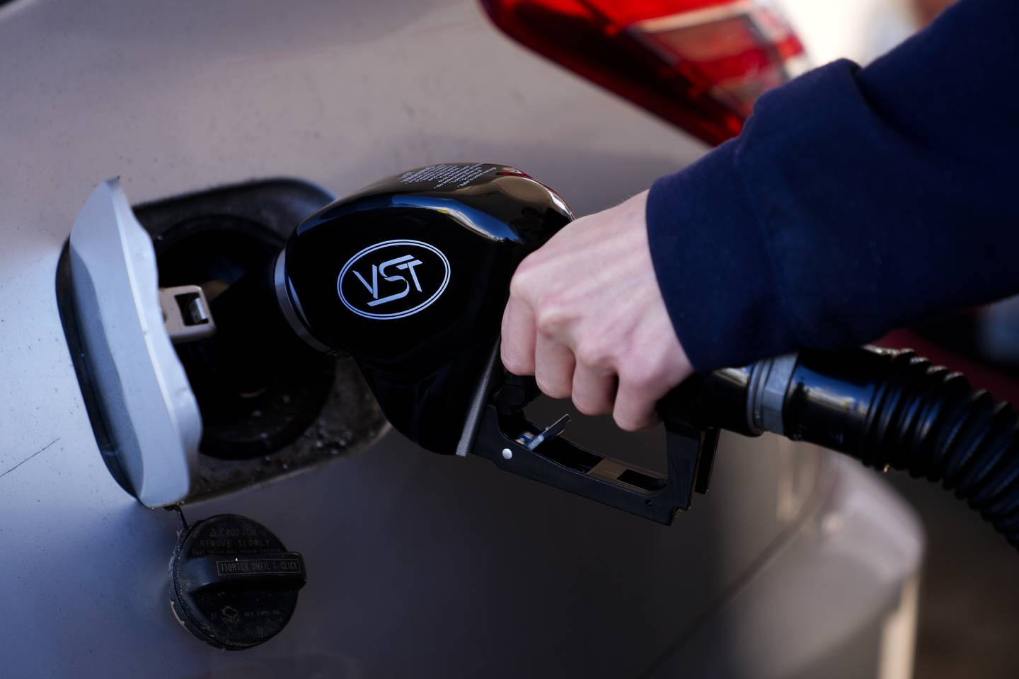 A driver fills up at a gasoline pump at a Shell gas station in Seattle.