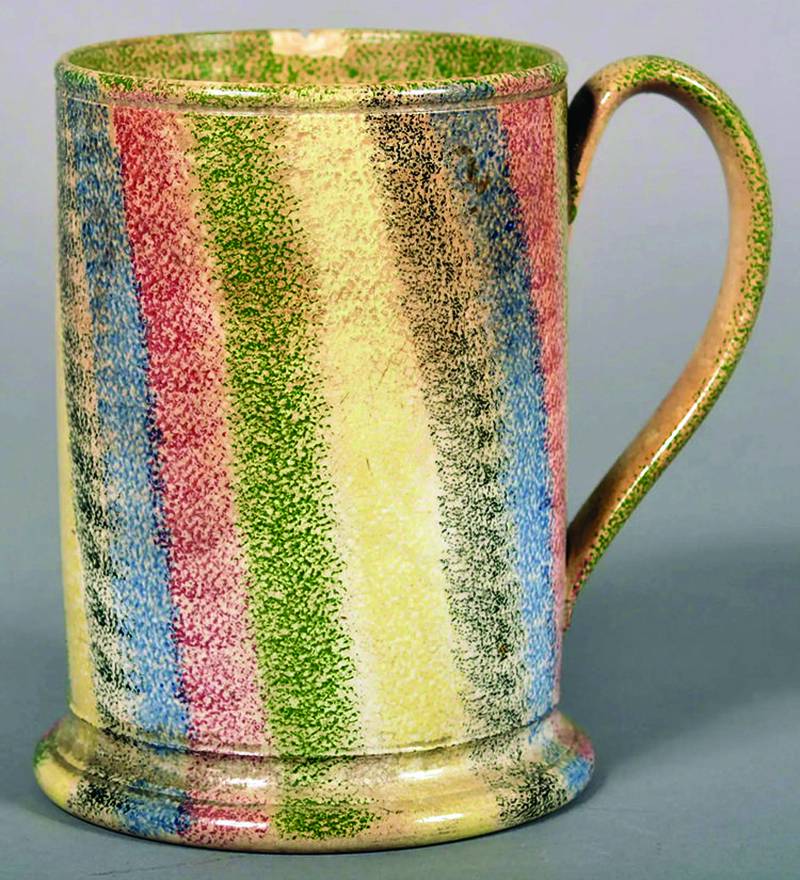 This mug features more colors than most spatterware pottery. That adds to its appeal — and its value.