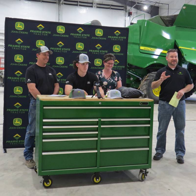 Eric Ebersole signs a commitment letter for Prairie State Tractor’s Tech Student Program as his father, Sheldon Ebersole, and mother Julie Ebersole, watch. Eric is a 2023 graduate of Milledgeville High School. He will be attending Lake Land College’s John Deere TECH Program. Eric attended Whiteside Area Career Center, where he stood out for his ability to complete tasks with minimal input from his instructors, as well as his work ethic and dedication to completing tasks.