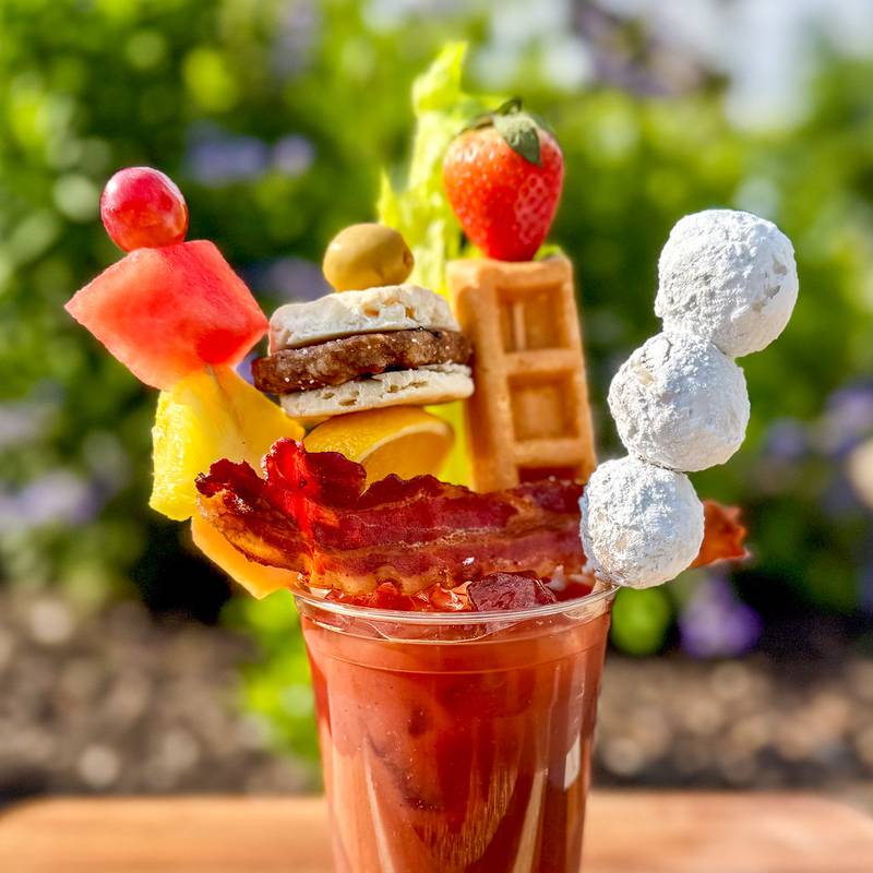 Brunch Mary by Urick Concessions. The Brunch Mary is a meal in a glass—garnished with skewers stacked high with a mini sausage breakfast sandwich, fresh fruit kebab, crispy bacon, fluffy donut holes and a golden waffle stick.