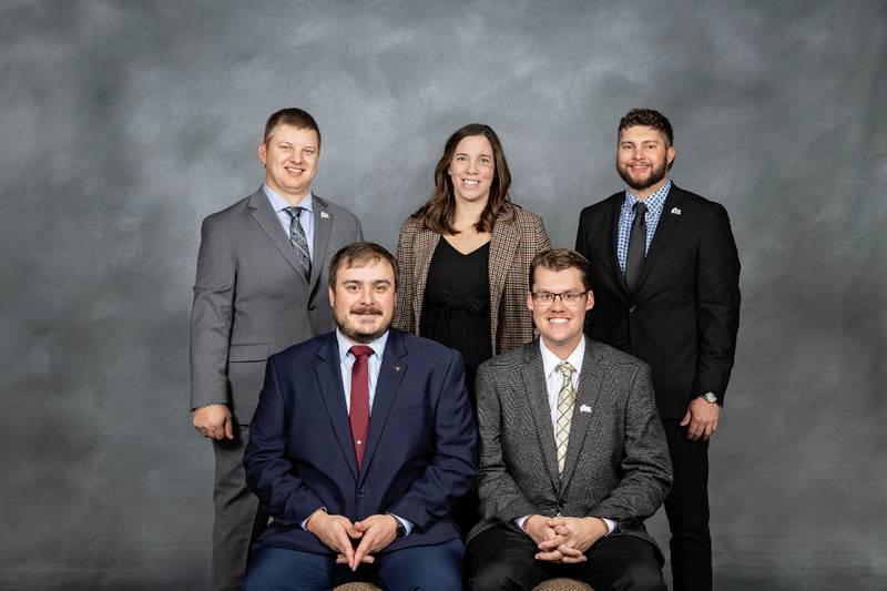 The 2026 Illinois Farm Bureau Young Leader executive committee includes: Chair Garrett Williams (front row, from left) of Richland County; Vice Chair Michael Bernhard of Kendall-Grundy; Governmental Affairs and Commodities Subcommittee Chair Cody Conrady (back row, from left) of Vermilion County; Achievement Subcommittee Chair Amber Towle of Tazewell County; and Education and Recruitment Subcommittee Chair Sam Deisher of Wabash County. Secretary Christina Weller of Stephenson County is not pictured.