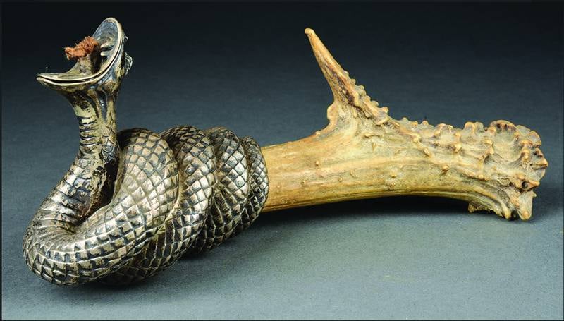 Is a snake cigar lighter a warning against the dangers of smoking or a way to make the smoker look tough? Sometimes a cigar is just a cigar, and a snake is just a snake.