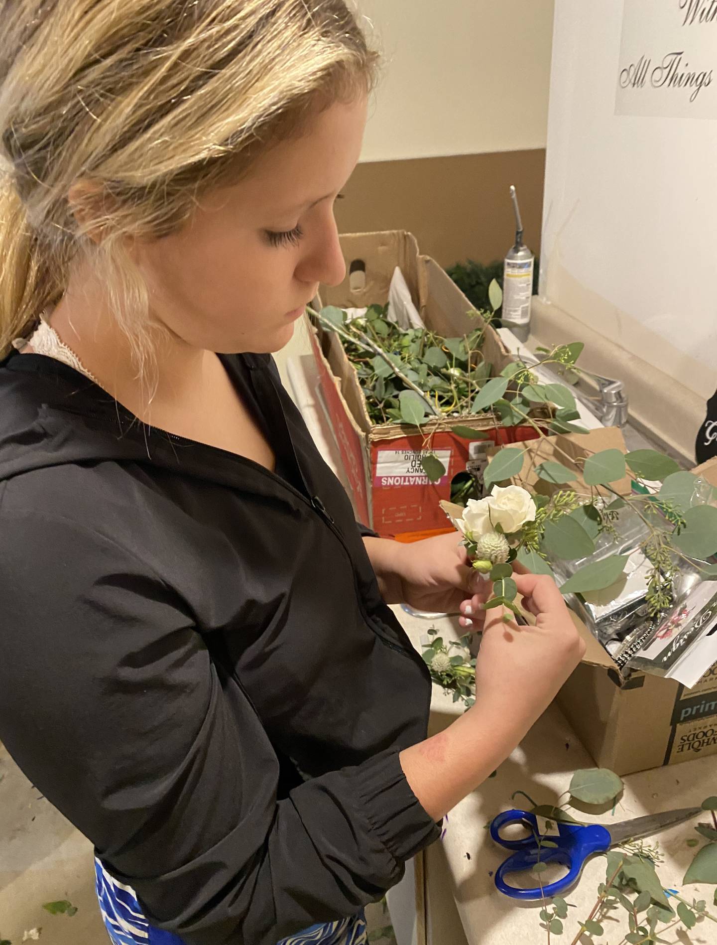 For her floral design business, Taylor Crouch creates arrangements for weddings, school events and funerals.
