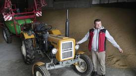 With unsold grain piled high, a Polish farmer faces an uncertain future as war in Ukraine grinds on