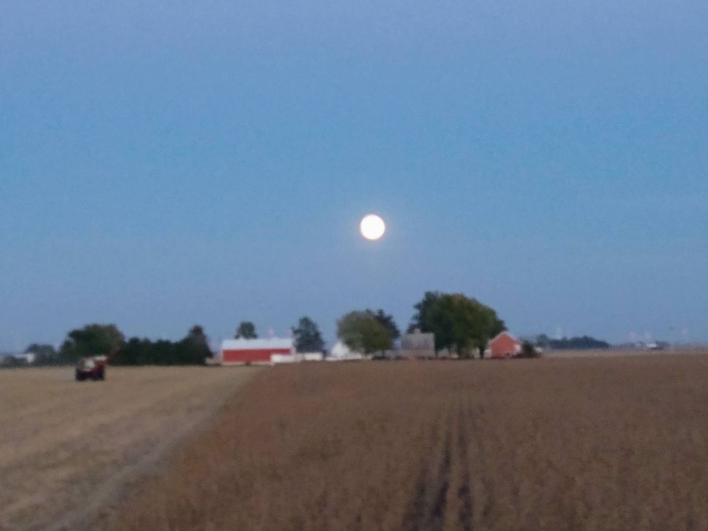 “Moon rising” — J.C. Reitmeier: “Combining beans at sunset with moon coming up in the east over our family farmstead.”