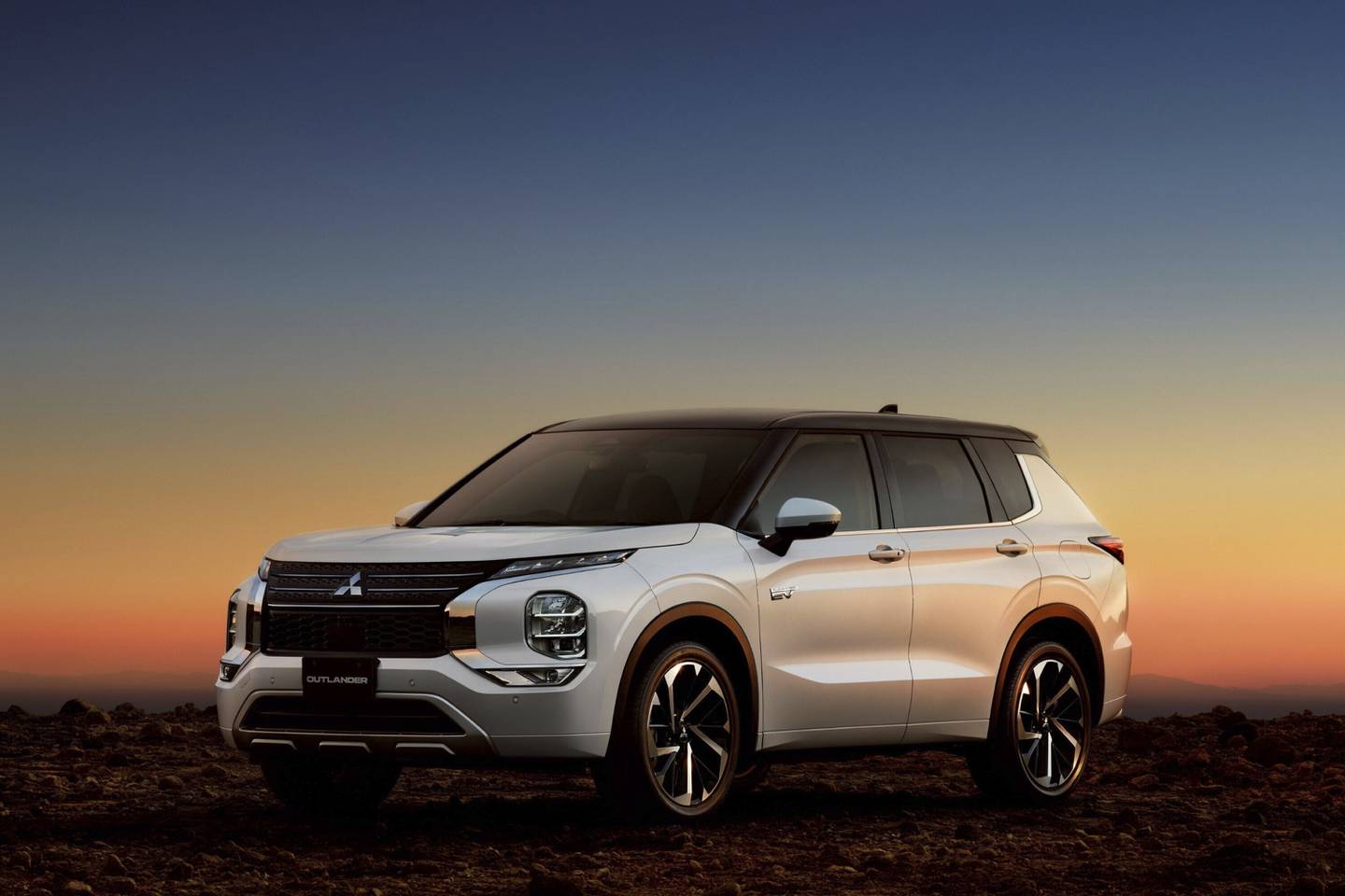 The plug-in three-row 2025 Outlander PHEV SUV by Mitsubishi can drive an estimated 38 miles on electric power before switching on its gas hybrid engine.
