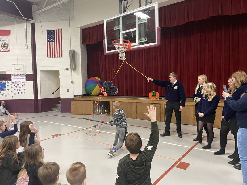 Breaking a piñata was part of the national award-winning project, Día de la Agricultura, created by members of the Cambridge FFA Chapter. The project included the development of Spanish books that were read to students in first through fifth grades.