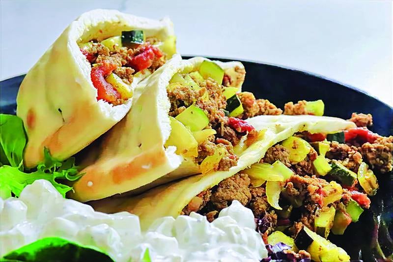 Pita pockets made with batch-cooked ground beef for an easy, flavorful meal.