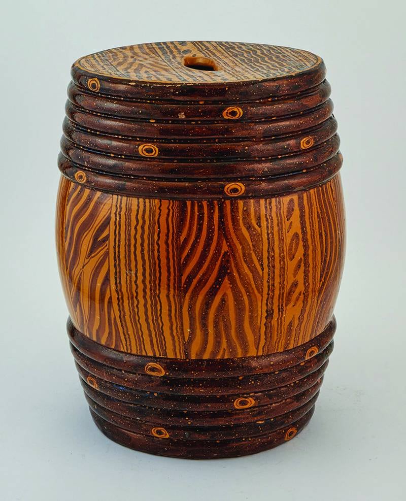 A wooden barrel sold for more than $2,000? No, it’s a ceramic garden seat made to look like a wooden barrel.