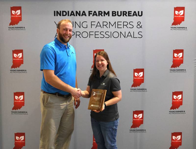 Jessica Wenning (right), Henry County Young Farmers & Ag Professionals chair, accepts the Outstanding County YF&AP Award. The YF&AP conference provides an opportunity for education and networking for INFB members under the age of 40.