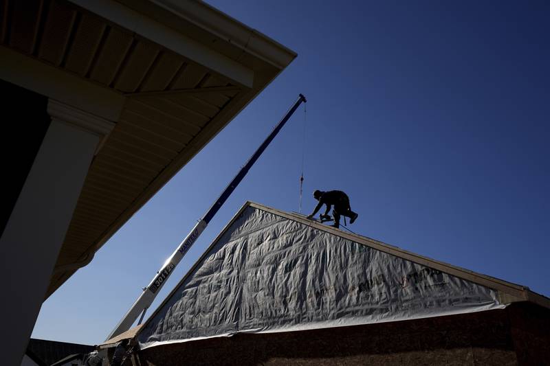 Construction workers frame a new single-family home Dec. 6, 2024, in Owensboro, Kentucky.