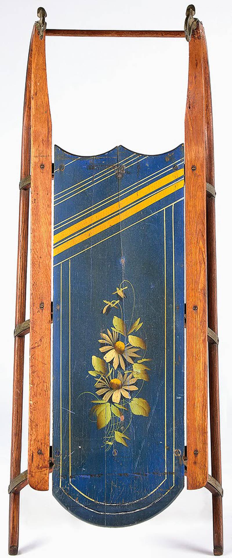 A painted sled makes a snowy day even more festive. Like many homemade toys, this one doubles as a piece of folk art. It sold for $380 including the buyers’ premium.