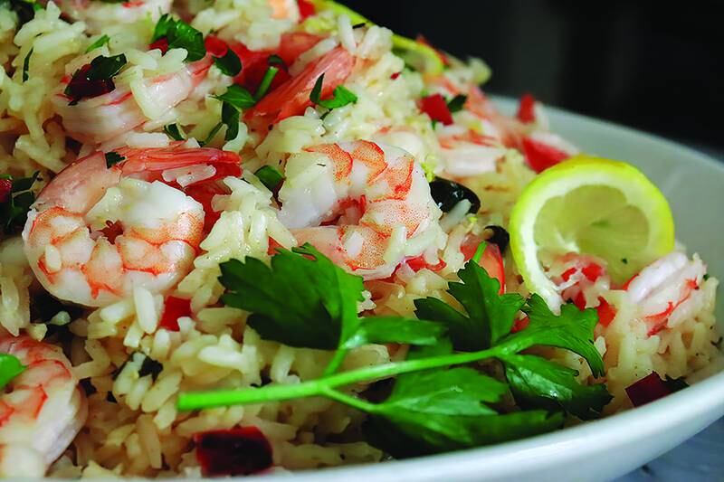 Juicy lemony shrimp nestled in fluffy rice is a great weeknight dinner option that’s light yet filling — and all cooked in one-pan.