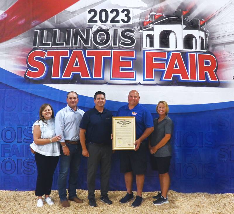 Emily McClelland (from left), Matt McClelland, Jerry Costello II, Frank Doll and Pam Doll with the 85th anniversary proclamation.