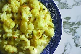 The humble cauliflower gets a golden, gooey makeover