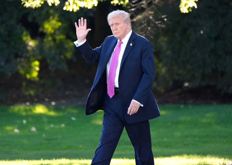 President Donald Trump waves as he walks to board Marine One before departing from the South Lawn of the White House in Washington.