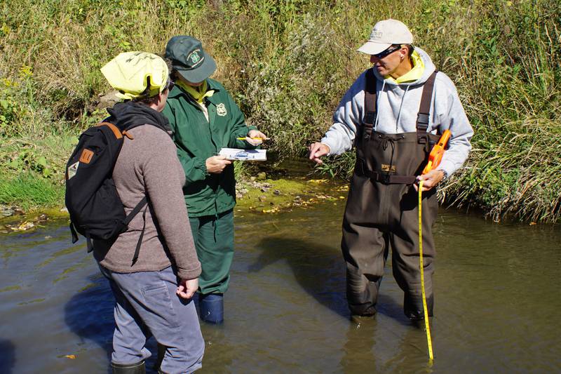 Plainfield resident Jim Pustz, a volunteer citizen scientist for Illinois RiverWatch, helps monitor stream at Midewin National Tallgrass Prairie in Wilmington. Here Pustz explains how to conduct stream surveys.
