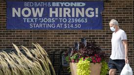 Fewer people seek unemployment aid amid solid hiring
