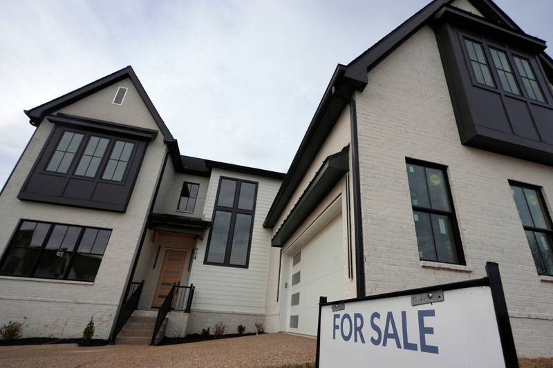 A for sale sign is posted outside a home in Nashville, Tennessee.