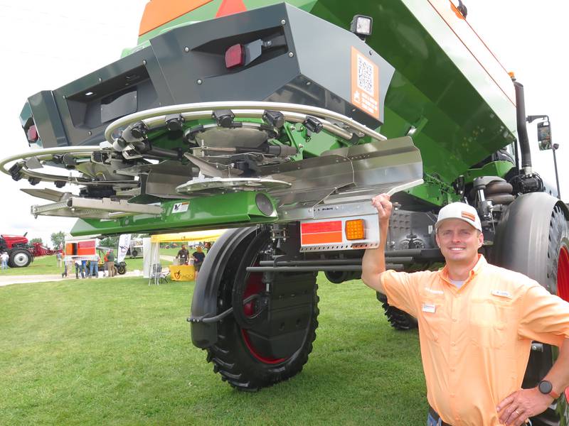 Samuel Bailey, Amazone North America product manager, points out the highlights of Amazone’s ZG-TS fertilizer spreader on display at the Midwest Ag Industries Exposition in Bloomington, Illinois.