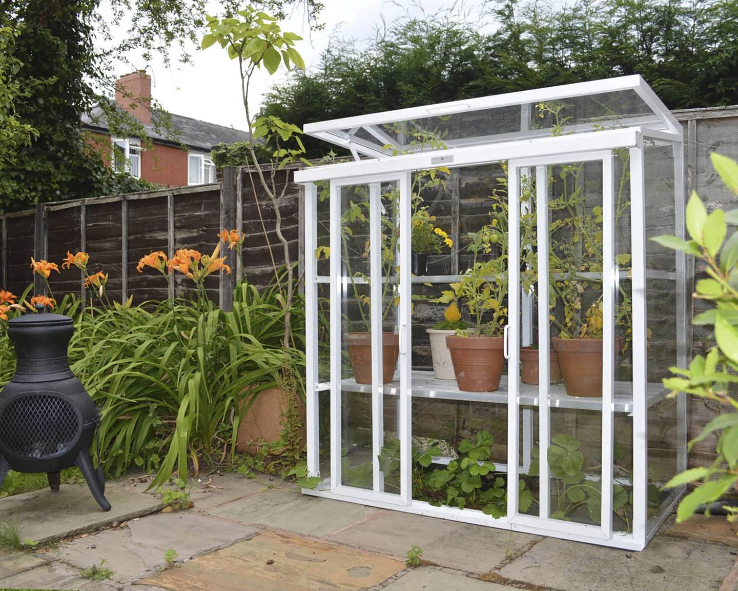 This image provided by Hartley Botanic shows a Patio model glasshouse with its hinged top pane open.