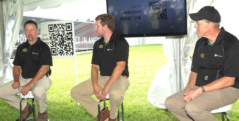 Chad Kalaher, field agronomist in east-central and northeast Illinois, makes a point about nitrogen application recommendations, along with Jim Schwartz (from right), director of research, agronomy and PFR, and Jon Skinner, regional agronomy manager in Illinois and Iowa, at the Beck’s Central Illinois Field Show at El Paso, Illinois.