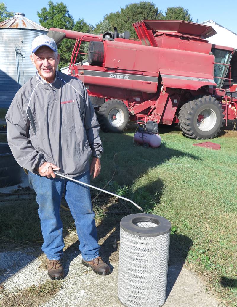 Rain kept Marcus Maier out of the cornfield in mid-October, giving him a chance for some combine maintenance, including cleaning out the filter. Maier served for five years in the U.S. Army after joining as 28-year-old.