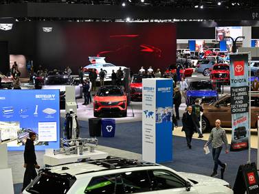 At Detroit auto show, spotlight dims for EVs