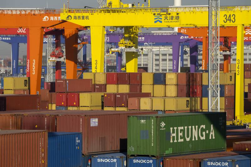 Shipping containers are stacked at a port in Tianjin, China.
