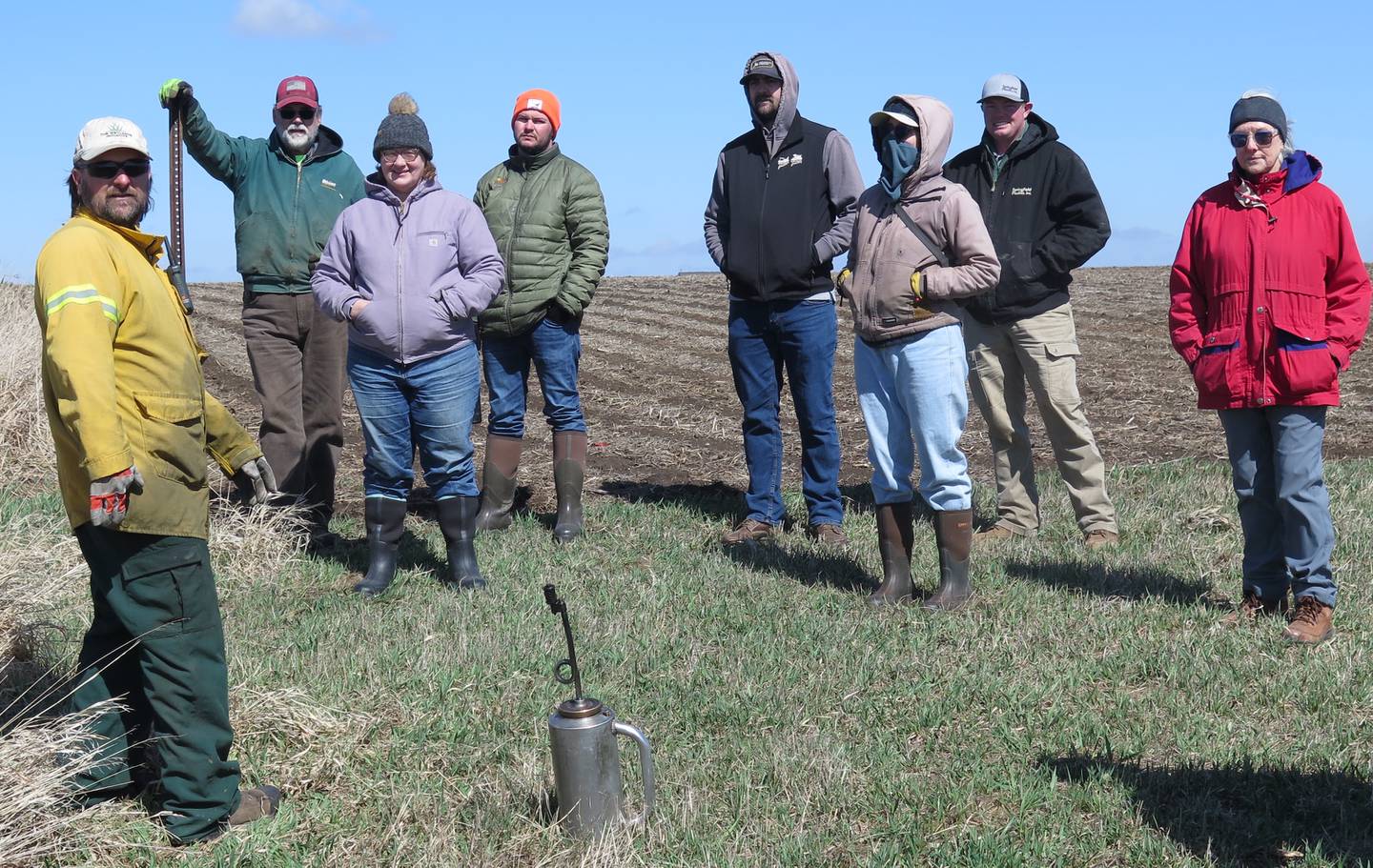 Justin Seibert (left) outlines the prescribed burn procedure at a constructed wetland in Livingston County in upper-central Illinois. The Smart Wetland, part of Fulton Farms, includes a 1.1-acre wetland treatment area and an adjacent 3.4-acre buffer of pollinator habitat that treats field tile water from about 73 acres of row cropland. Jim Fulton (second from left) is co-owner of Saunemin-based Fulton Farms.