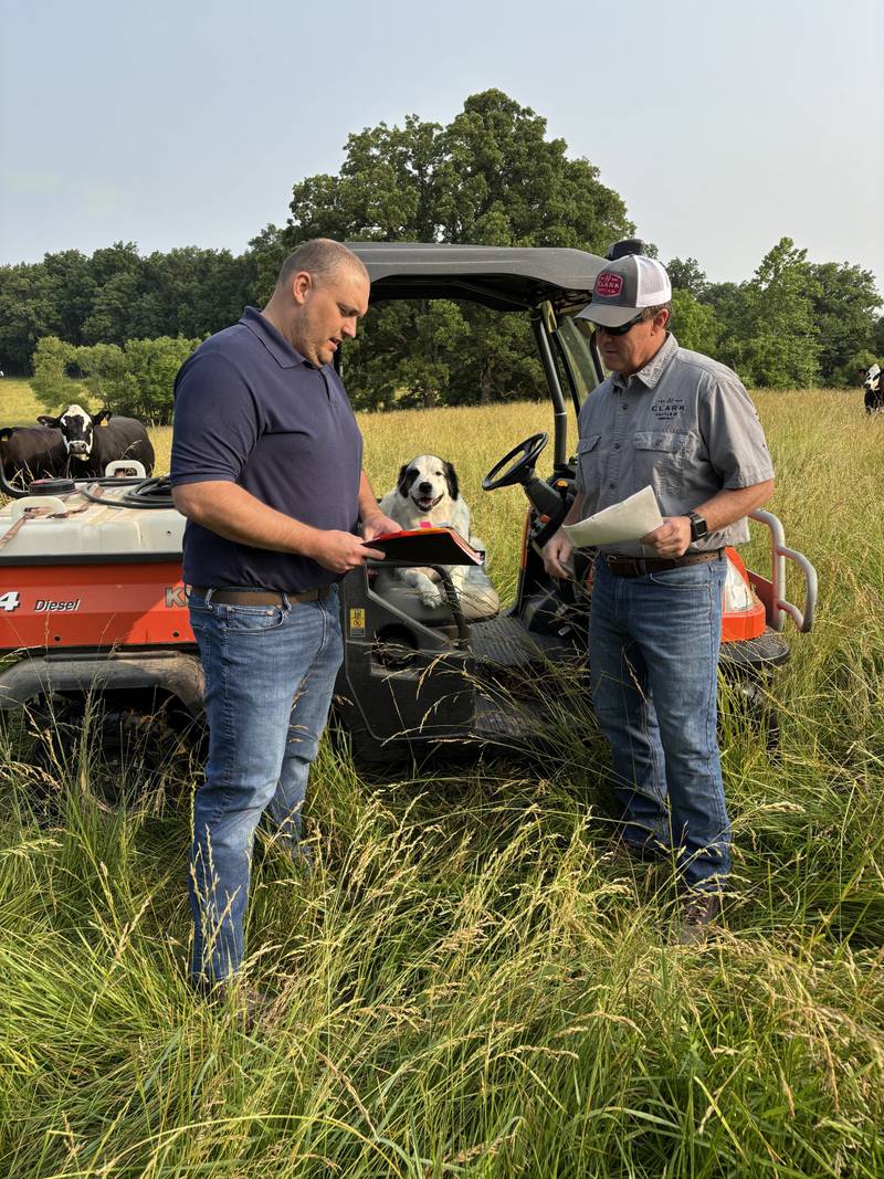 Area 4 Grazing Lands Specialist Kevin Halsey (left) is pictured with herd boss Lacey and Williamson County producer Brent Clark during a recent site visit.