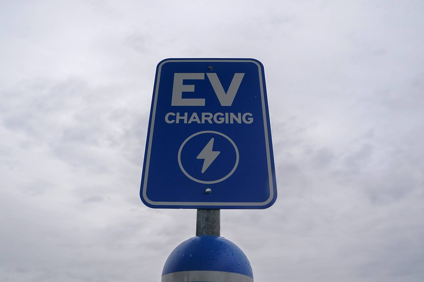 A sign is displayed at an electric vehicle charging station, March 8, 2024, in London, Ohio.