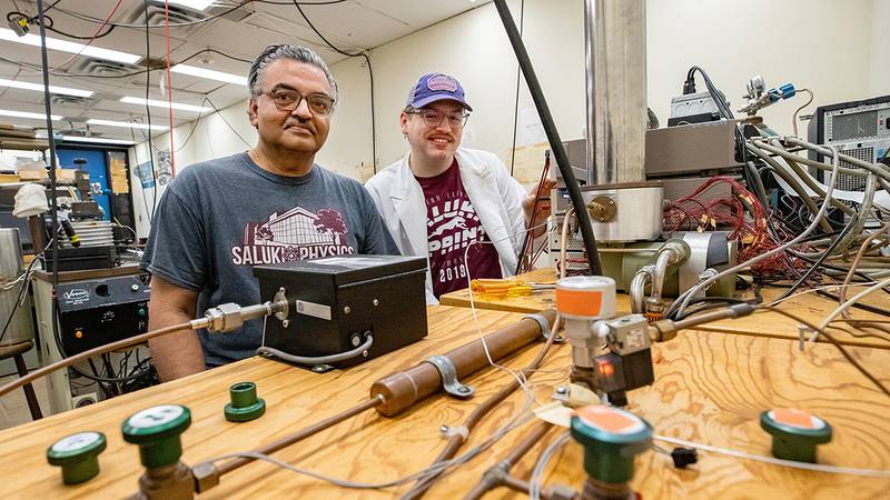 Saikat Talapatra (left), professor in the School of Physics and Applied Physics, and Nathanial Smith, a graduate student from Decatur, work in Talapatra’s laboratory at Southern Illinois University. Talapatra has received a Fulbright fellowship to develop CO2-capture materials made from agricultural waste products in India.