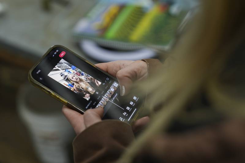 Zoe Kent edits a social media video on the TikTok app at her farm in Bucyrus, Ohio.
