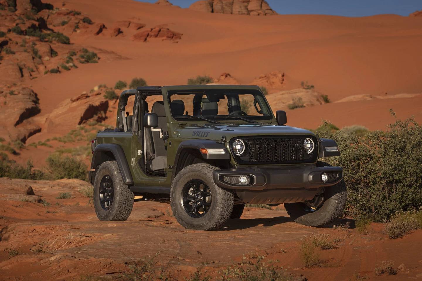 This photo provided by Jeep shows the 2024 Wrangler Willys. Highlights of the Willys trim include 33-inch all-terrain tires, side rock rails and locking rear differential.