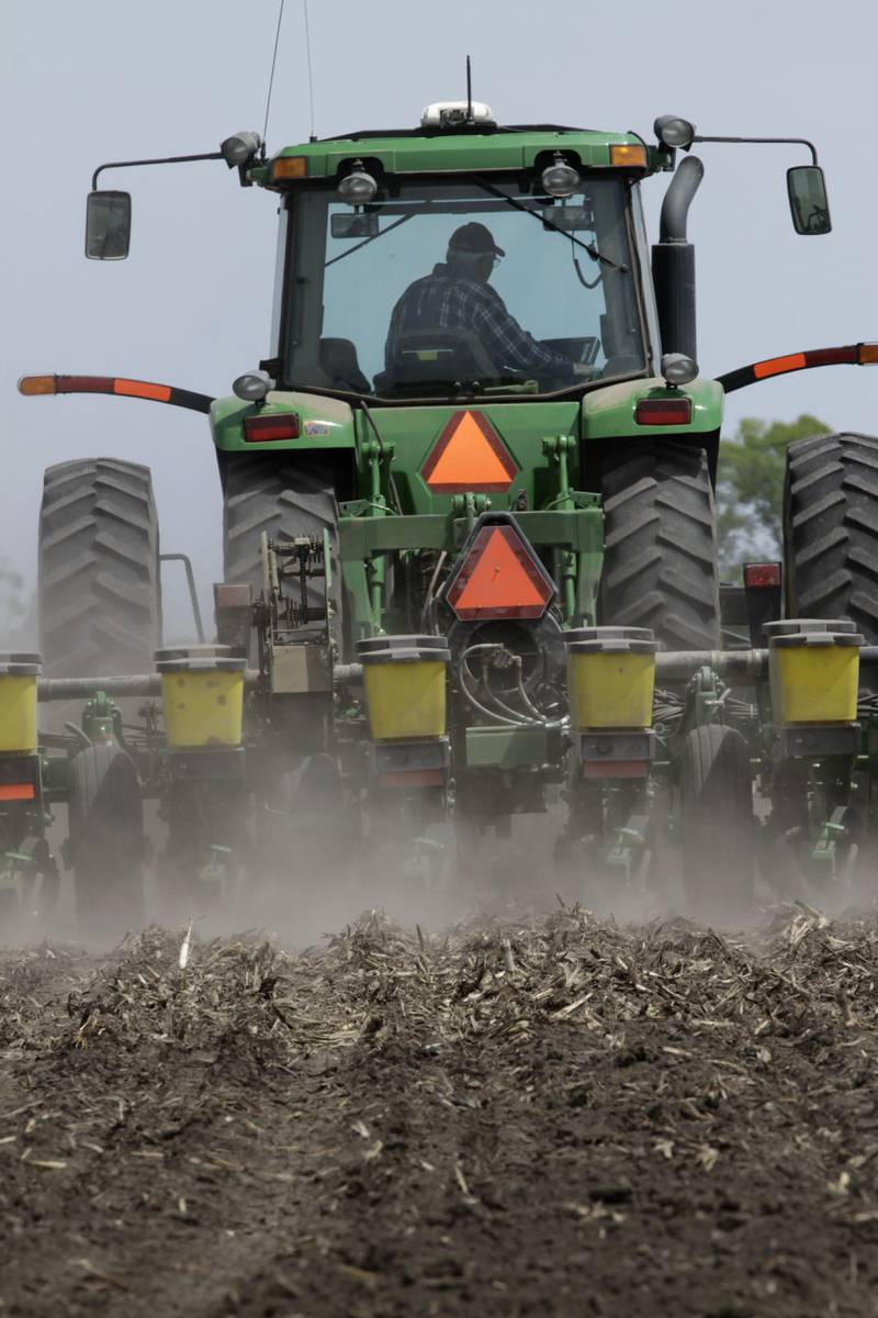 A farmer plants corn seeds near Auburn in central Illinois.