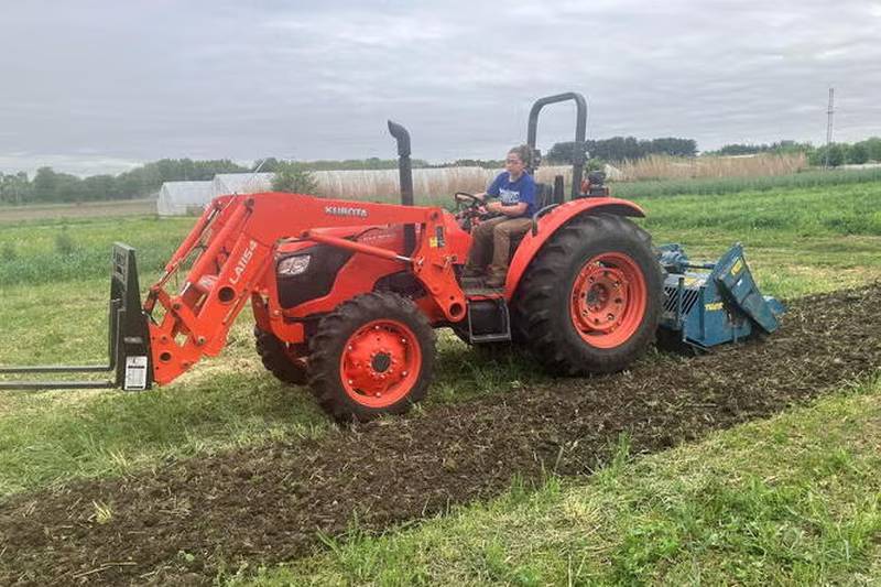Lia Basden, the inaugural graduate of the Small Farm Certificate Program at the University of Illinois, gets practical experience working at the Sustainable Student Farm.