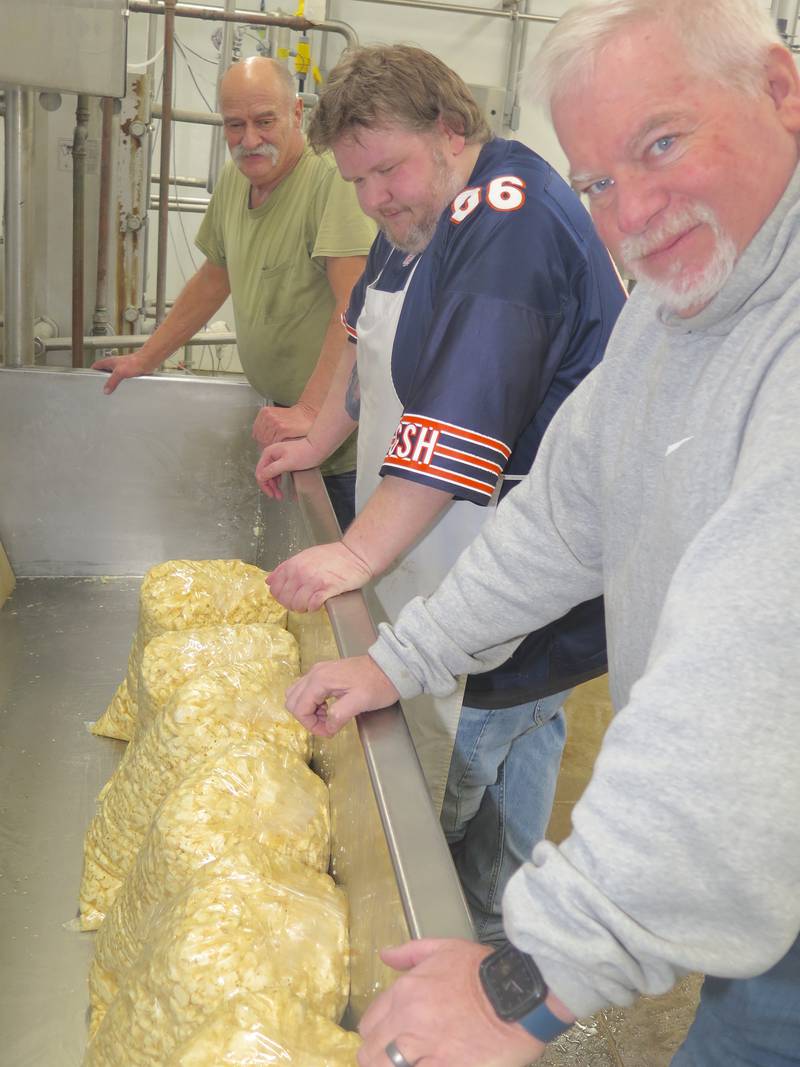 Jerry Pratt (from left), Matt Stoecker and Ken Ropp wrapped up making and bagging the final supply of cheese curds at Ropp Jersey Cheese on Jan. 26. The on-farm store and business closes Feb. 7.