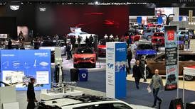 At Detroit auto show, spotlight dims for EVs
