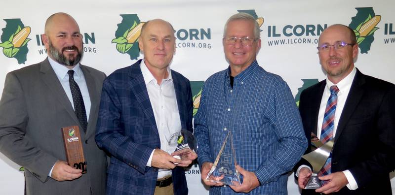 The Illinois Corn Growers Association honored five individuals for their efforts in supporting the industry during its annual meeting Nov. 26 at the AgriCenter in Bloomington. Honorees were Kris Reynolds (from left), Mike Pumer Environmental Award; Jim Taylor, Excellence in Media Award; Cade Bushnell, Randy Stauffer Stewardship Award; Eric Mosbey, Ethanol Award; and George Obernagel (not pictured), World of Corn Award.