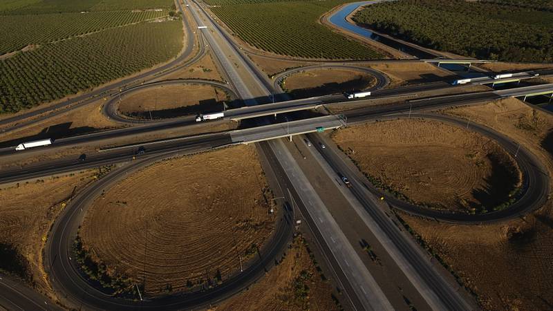 Freight trucks travel northbound on Interstate 5 Highway in northern California.