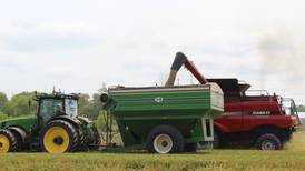 Future of farming: Driverless tractor pulls grain cart, synchs with combine during harvest
