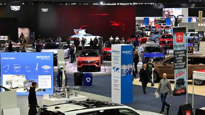 At Detroit auto show, spotlight dims for EVs