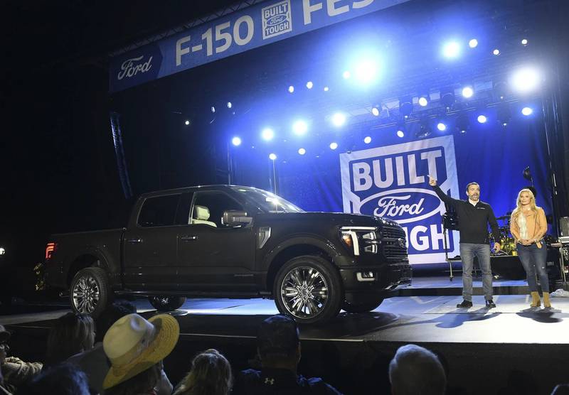 John Emmert, Ford’s general manager for trucks in North America, talks about the 2024 Ford F-150 reveal at the F-150 Fest at Hart Plaza in Detroit on Sept. 12. Emcee Cristy Lee is at right.
