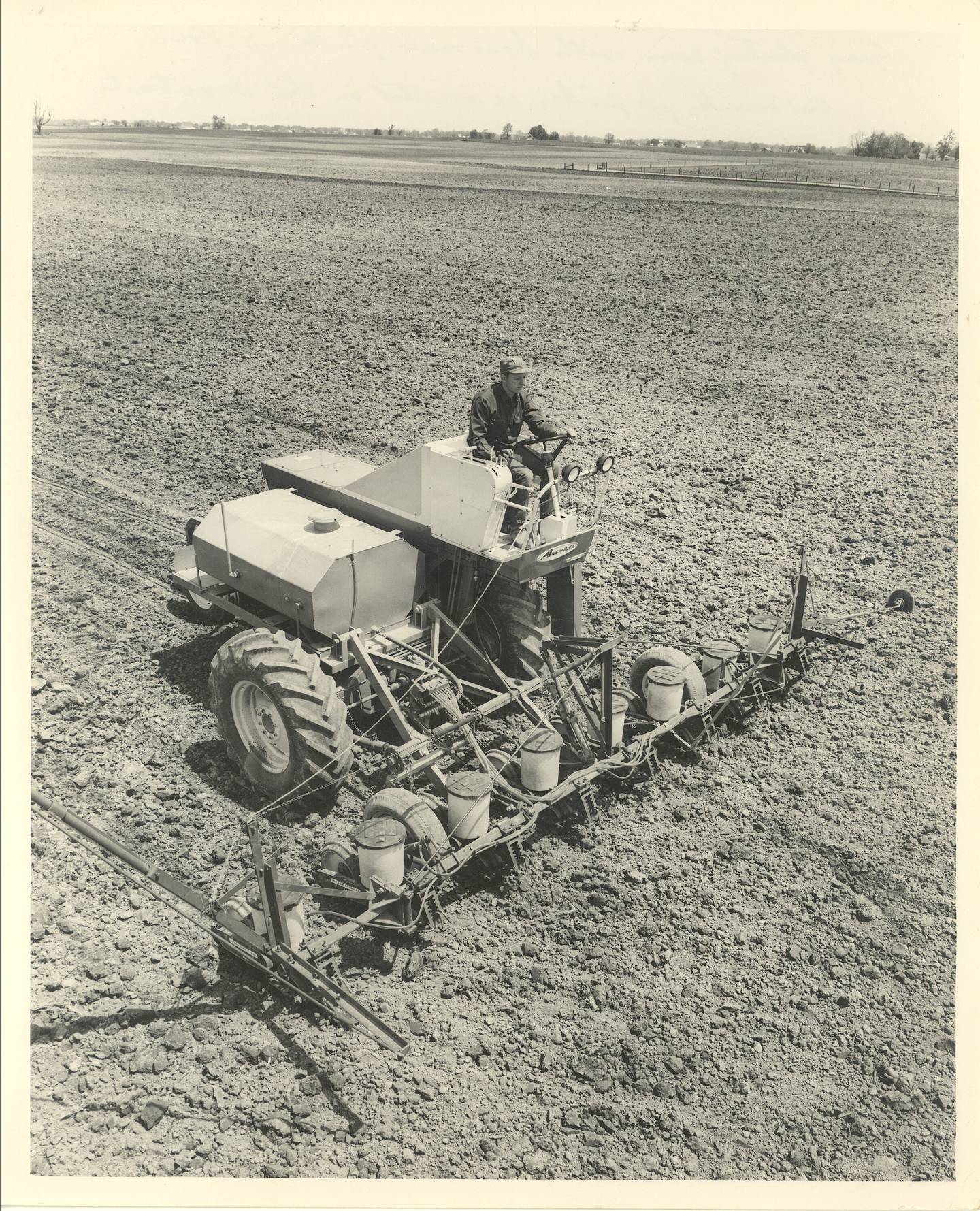 Sonny Beck drives a homemade planter in 1968.
